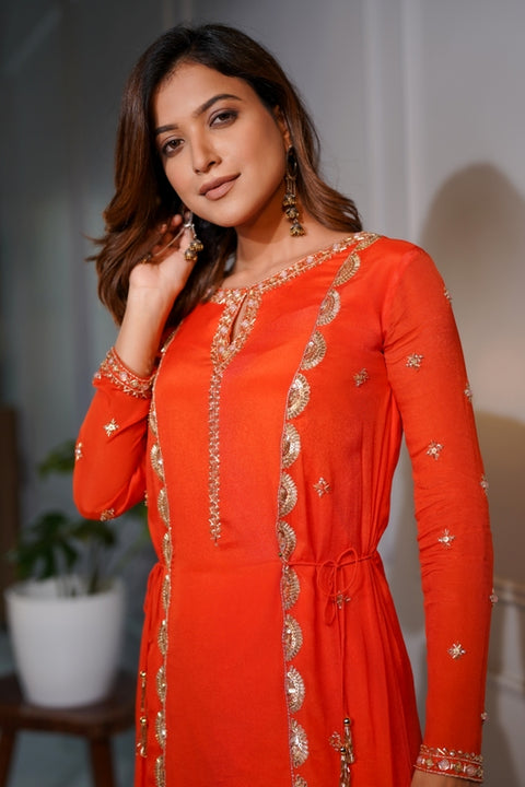 Orange crepe short tie up tunic with dhoti set.