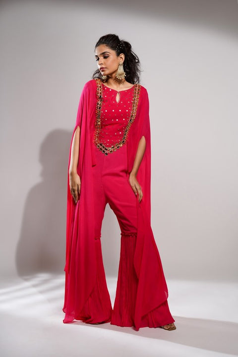 Fuchsia pink flared leg and flared sleeves jumpsuit.