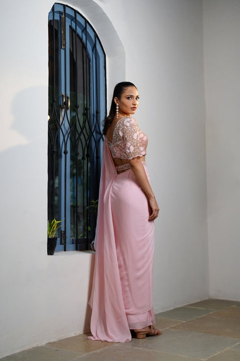 Baby pink draped saree with blosure and waist belt.