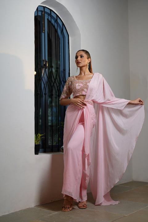 Baby pink draped saree with blosure and waist belt.