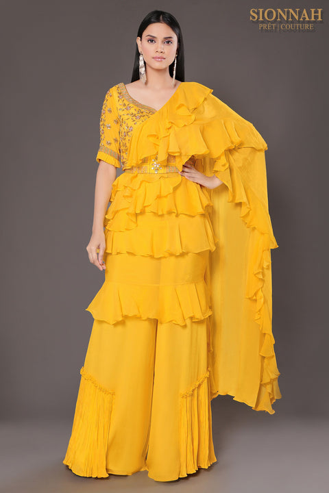 Mustard yellow multi layered gharara saree.