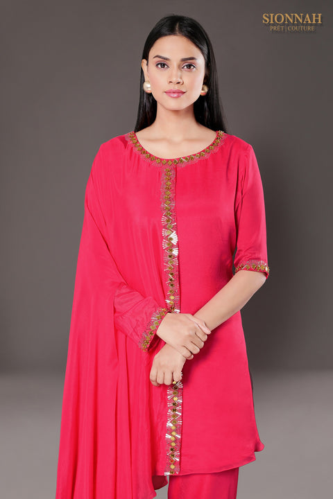 Hot pink one side flared tunic with tulip pants.
