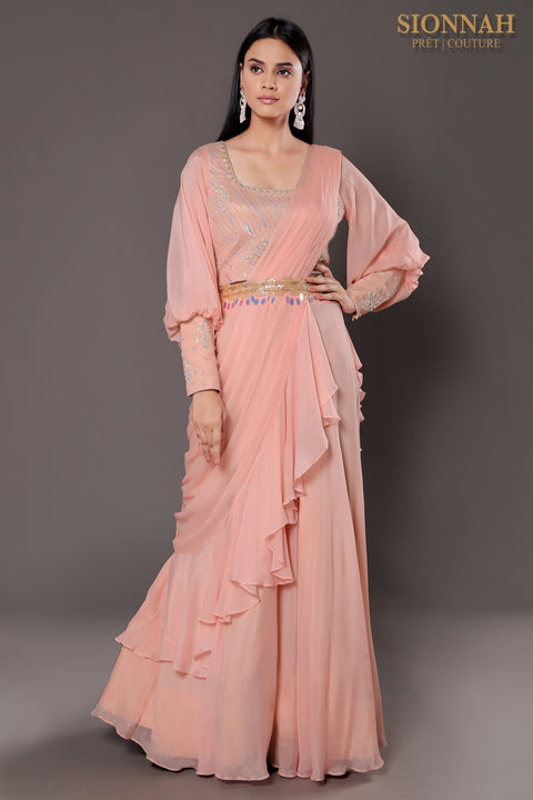 Baby pink balloon sleeves crop top with draped saree.