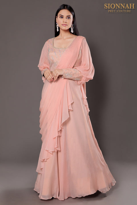 Baby pink balloon sleeves crop top with draped saree.