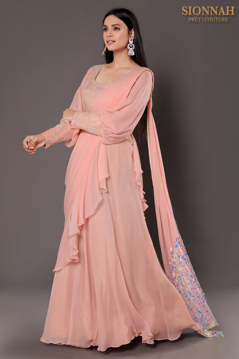 Baby pink balloon sleeves crop top with draped saree.