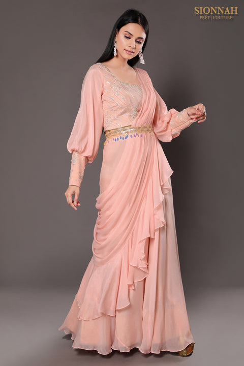 Baby pink balloon sleeves crop top with draped saree.