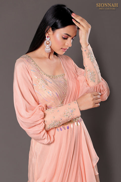 Baby pink balloon sleeves crop top with draped saree.