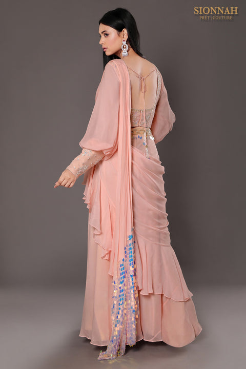 Baby pink balloon sleeves crop top with draped saree.